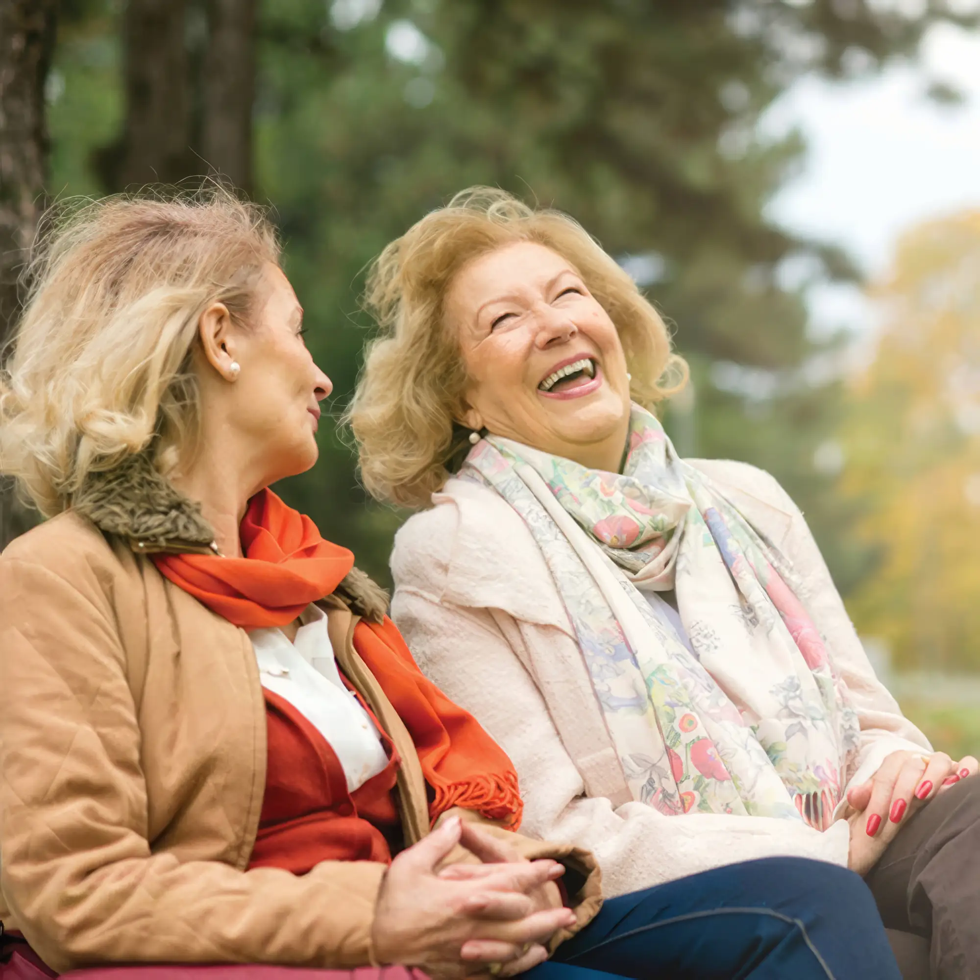 Two elder women talking and laughing