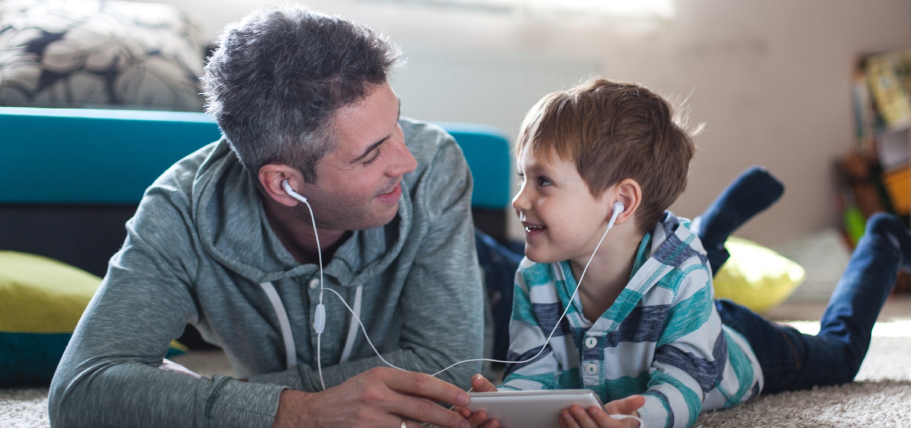 Dad and son listening to music